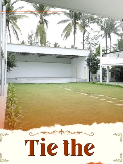 Tie the knot at 'The Venue' on Kanakapura Road, a beautiful space with a dedicated stage area on a manicured lawn, perfect for wedding ceremonies and receptions.