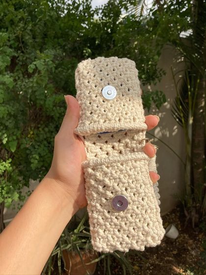 A look inside our mini wallet, showing the two separate compartments secured with magnet buttons. We designed it to be both cute and practical.