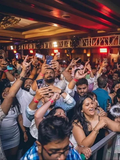 Capturing the joy of the crowd during a corporate New Year's Eve bash. It's all about creating those picture-perfect moments.