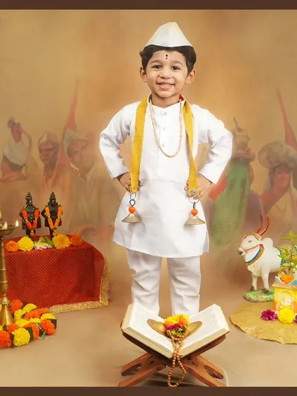 A proud little Varkari standing tall. We love capturing the confidence and joy of children in our themed shoots.