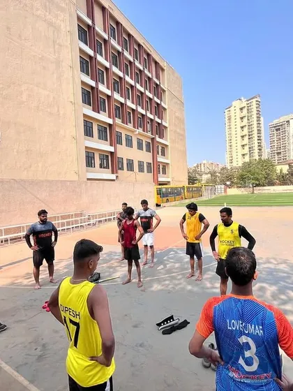 A group of players listening to instructions before starting a fitness circuit. Discipline and focus are just as important in conditioning as they are in skill drills.