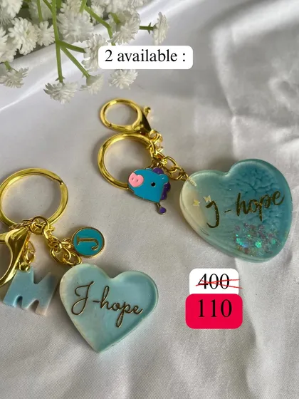 Sunshine for our sunshine. These J-Hope keychains are bright and cheerful, just like him. One even comes with a little Mang charm.