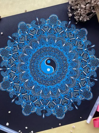 Using gelly roll pens on black paper creates a stunning contrast that makes the colors pop. This 12-inch Yin-Yang mandala represents the balance of opposing forces, a spiritual symbol that I find deeply therapeutic to draw and hope it brings harmony to your space.