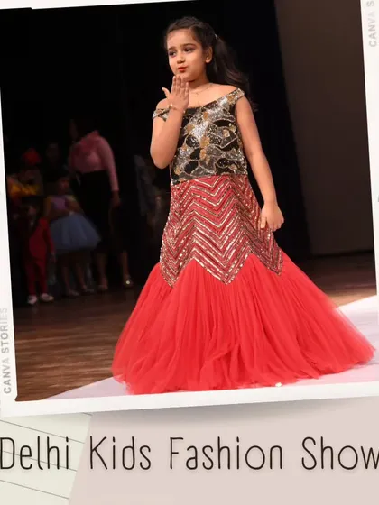 Blowing a kiss to the audience, this model shines in a spectacular red and silver gown. It’s these moments of interaction and confidence that make the shows so special.