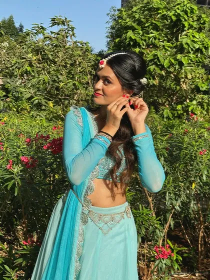 Close-up shots showing the expressive details of a semi-classical performance, from the hair and makeup to the hand gestures (mudras).