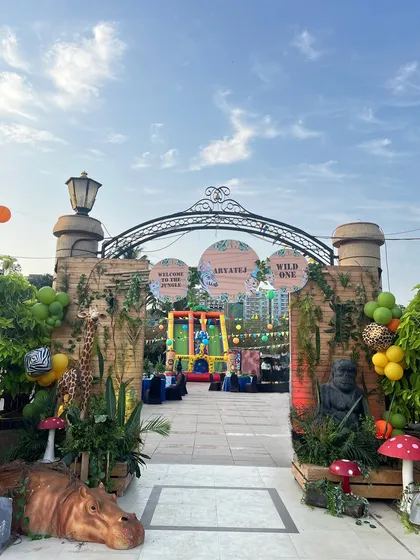 We specialize in bringing grand themes to life, like this 'Wild One' safari adventure. The custom entrance arch, complete with life-sized animal props and lush greenery, set the stage for an unforgettable first birthday celebration.