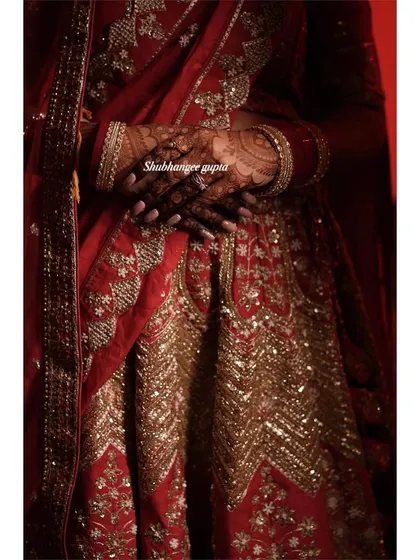 The deep color of the henna stain looks so regal against the bride's red wedding outfit. I always provide aftercare instructions to help you get a stain this dark.