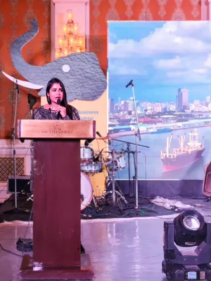 On stage at the SolutionX Summit, with the event's thematic branding in the background. I ensure the focus remains on your brand and message.