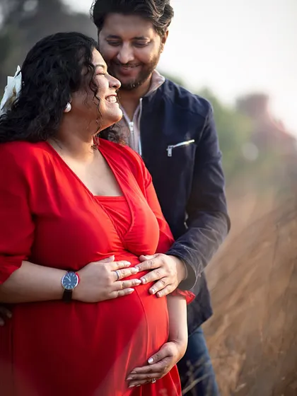A close-up shot capturing the loving gaze and happy smiles shared between the couple during their outdoor session.