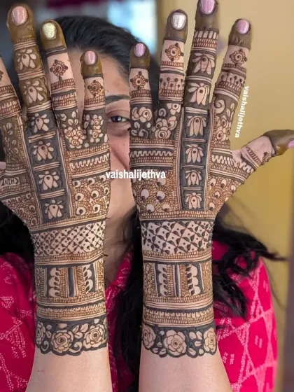 A lovely back-hand design with a mix of floral and geometric patterns. The rose cuff at the wrist adds a soft, feminine touch.