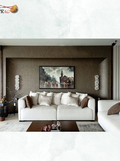 A heritage Mumbai cityscape painting adds a touch of nostalgia and sophistication to this contemporary living room with textured walls.