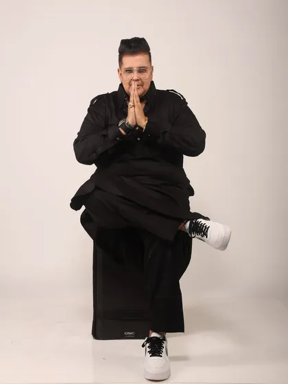 A respectful 'namaste' pose. While my energy is high, I am always grateful for the opportunities I get and the people who support me.