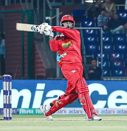Dhruv Singh executing a perfect cover drive in a professional match. A classic shot from a classy player.