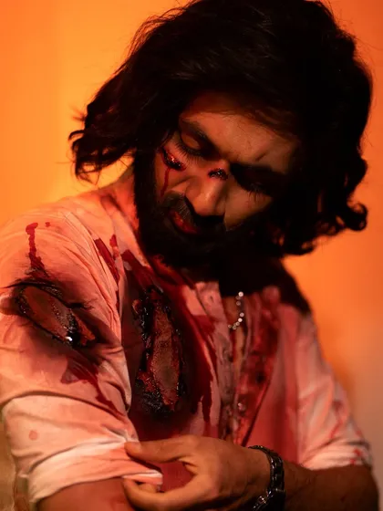 An atmospheric shot of the 'Animal' movie SFX look, showing how the makeup looks in a dramatic, cinematic lighting setup.