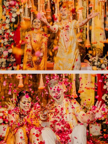 The couple enjoying the petal shower together, a highlight of their vibrant Haldi ceremony.