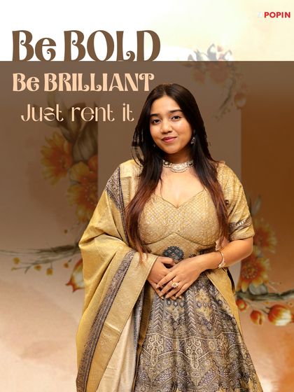 Be bold, be brilliant, just rent it. This graphic features a golden and grey printed lehenga, perfect for a sophisticated look.