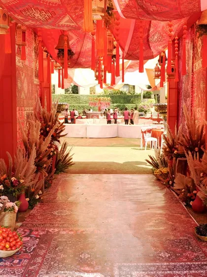 We transported guests to a different world with this Souk Bazaar themed Mehndi. The entrance, rich with layered red textiles, intricate patterns, and hanging tassels, was designed to be an immersive first step into a vibrant, cultural celebration.