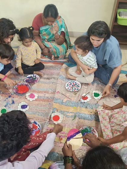 A colorful and slightly messy scene from a painting session. We believe that creative messes are part of the fun.