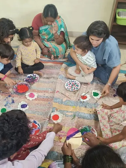 A messy but joyful moment from our chameleon painting workshop. We believe in the value of sensory play and getting a little messy.