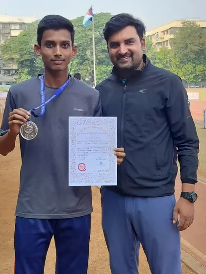 Celebrating a silver medal win with one of my dedicated athletes.