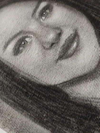 A close-up, angled shot of the Selena Gomez drawing, emphasizing the texture of the canvas.