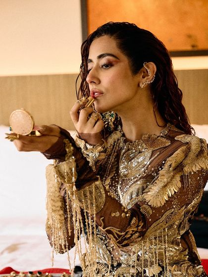 A series of images capturing the stunning Rahul Mishra Couture outfit I styled for Jonita Gandhi's performance. The detailed embroidery, flowing silhouette, and pairing with thigh-high Louboutin boots created a look that was both ethereal and powerful.