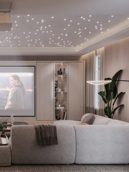 This view shows the projector screen and the custom cabinetry designed to discreetly house AV equipment.
