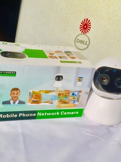 The dual-lens AI HD IP Camera ready for setup. This network camera connects to your phone for easy monitoring of your home or business.