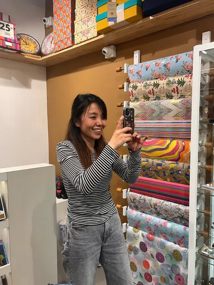 A happy moment captured at my new store opening. Here's a team member taking a photo of our beautiful gift wrap collection.