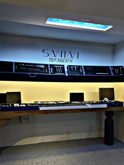 Our display showcasing Santan lighting products at the Acetech exhibition. The setup includes a range of technical lighting tools and an artificial skylight, all neatly arranged for exploration.