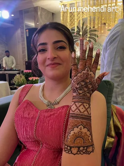 A beautiful single-hand design for a party guest. The pattern is dense on the hand and lighter on the arm, making it elegant and comfortable to wear.