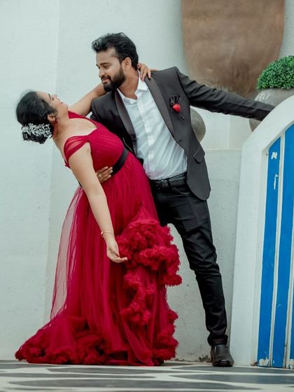 A fun and romantic dip-dance pose. The movement of the red ruffled gown adds energy and passion to this pre-wedding photo.