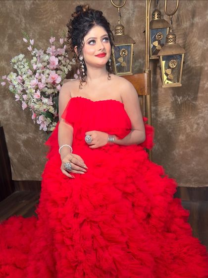 Another beautiful pose in the red gown. It’s a versatile piece that can be styled for a classic or a modern glamorous look.