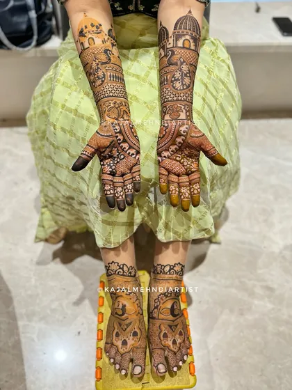 A complete bridal look for both hands and feet. The design is consistent, with architectural motifs on the arms and matching patterns on the feet.