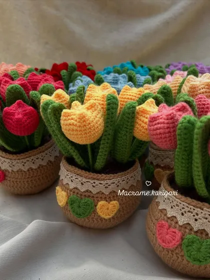 A whole family of our crochet tulip pots ready to be shipped out. It's so rewarding to see a large batch of these colorful creations all together.
