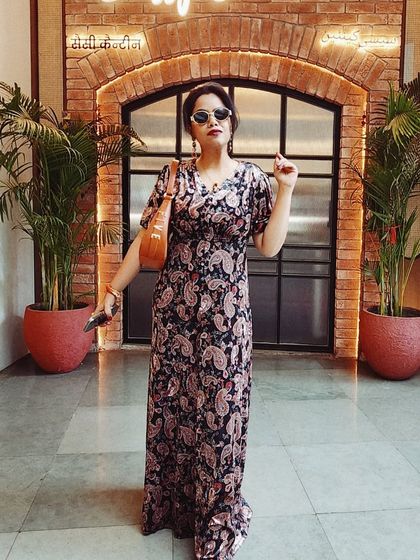 This flowing paisley print maxi dress is the definition of effortless elegance. It's a one-and-done outfit that looks polished for a day out.