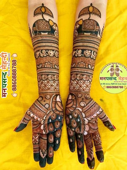 A classic bridal design with decorated elephants on the forearms and peacocks on the palms. The rich, dark stain makes the intricate details pop.