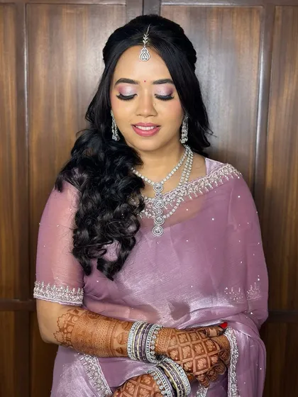 An eyes-closed shot to highlight the shimmery pink and purple eyeshadow.