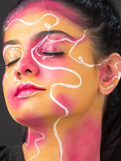 The side profile shows how the design extends and wraps around the facial contours.