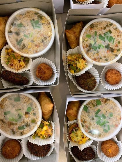 A look at my versatile snack boxes, packed with items like veg fried rice, mini samosas, and hara bhara kababs. I can customize the menu to fit your party's theme.