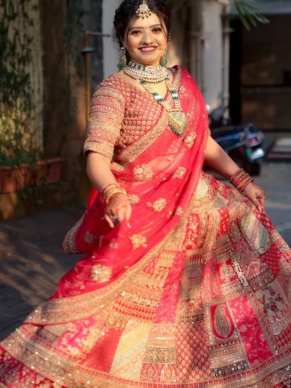 A full-length shot of a bridal look created by a student, showcasing their skill in both makeup and styling.
