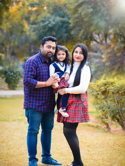 A beautiful family photo in the park. I help pose families in a way that feels natural and comfortable, resulting in genuine portraits.