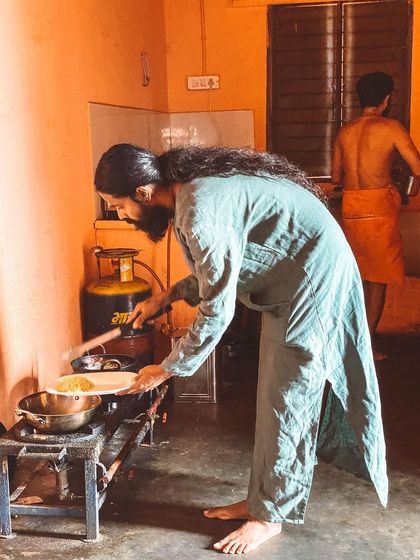Yoga is found in every action, even in the kitchen. Here, I am preparing a simple meal. Cooking with mindfulness and love is a form of service (seva) and a practice of yoga itself.