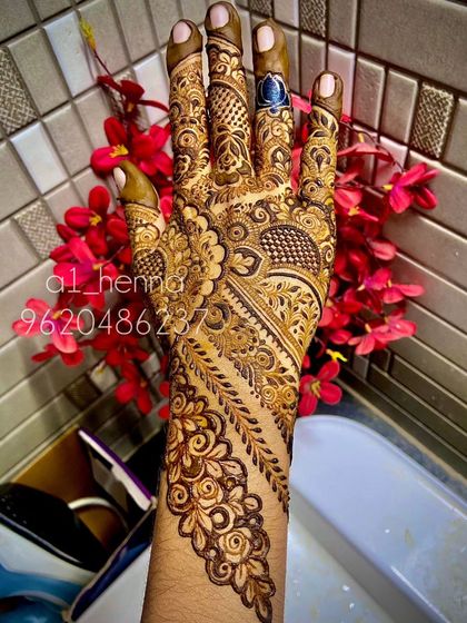 A close-up of an intricate design, showcasing a diagonal pattern that is characteristic of Arabic henna art.