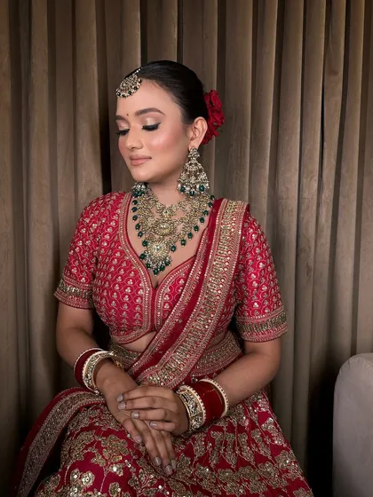 A moment of peace and beauty. The intricate jewellery stands out, adding a layer of grace to the bride's look.