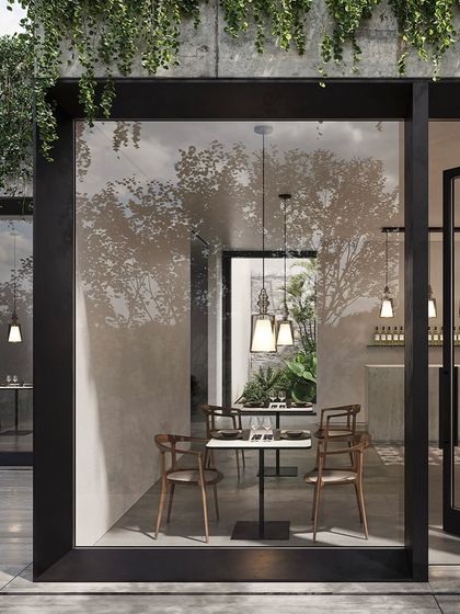 Alibaglass pendants are used to create an intimate dining atmosphere in a modern restaurant with large glass walls. The lights add a touch of elegance without obstructing the view.