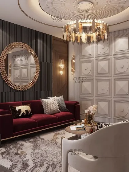 This formal sitting area is perfect for relaxing with friends. A bold red sofa provides a pop of color against a backdrop of dark fluted panels and a white 3D-paneled wall, creating a sophisticated contrast.