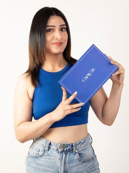 A smiling model presenting the product box, conveying customer satisfaction and brand trust.