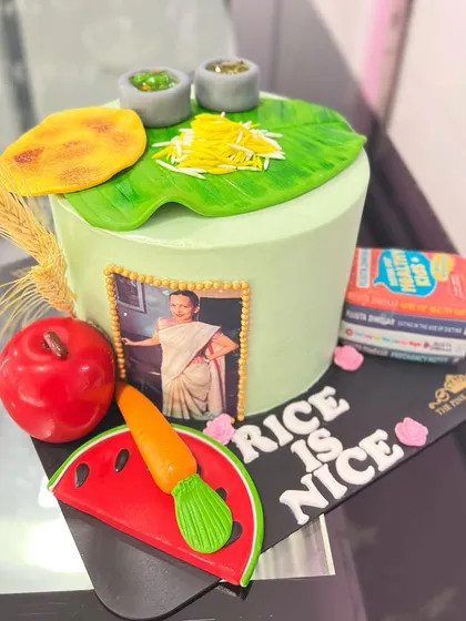 A special cake we created for celebrity nutritionist Rujuta Diwekar. The design incorporates healthy food elements like a banana leaf meal, fruits, and her book.