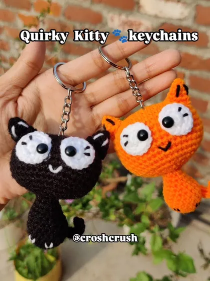 Meet my quirky kitty keychains. I designed these with big, expressive eyes and a playful look. Available in black and orange, they are a super fun accessory for any cat lover to show off their personality.